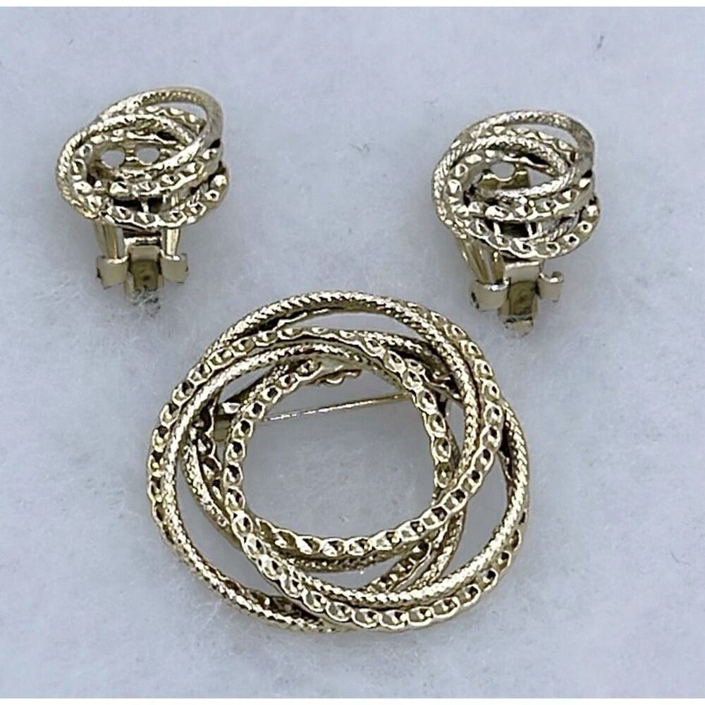 Vintage ornate swirl textured brooch and earrings set.